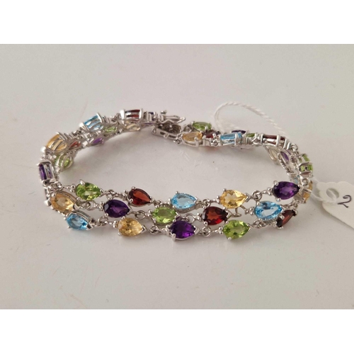 284 - A silver multi gem stone set bracelet 7.5 inch