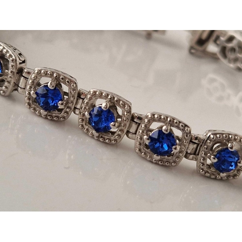 288 - A silver multi blue stone bracelet 7.5 inches