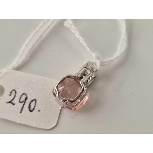 290 - A white gold diamond and pink stone pendant