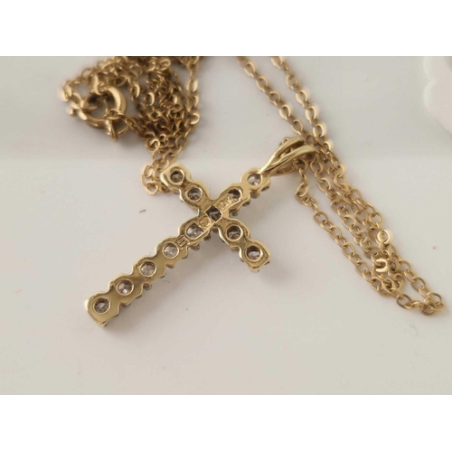 304 - A 10ct gold diamond cross on a 9ct chain 18 inch