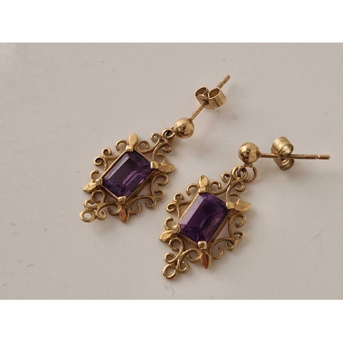 305 - A pair of square cut amethyst drop earrings 9ct