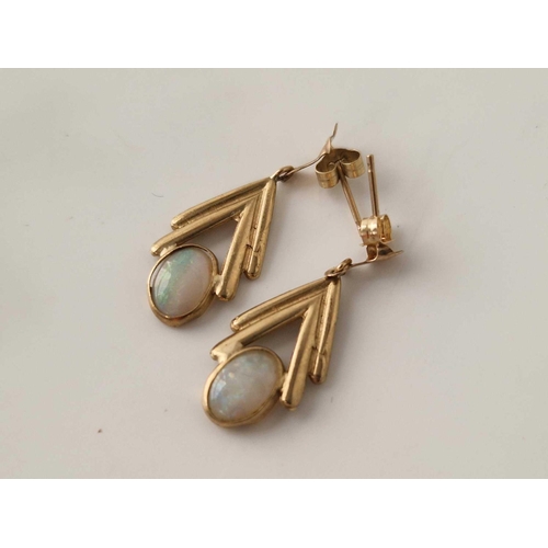 306 - A pair of opal drop earrings 9ct