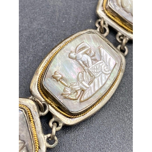 343 - A silver multi panel bracelet with Grecian theme 7.5 inch