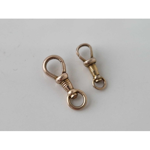 39 - Two antique gold dog clips