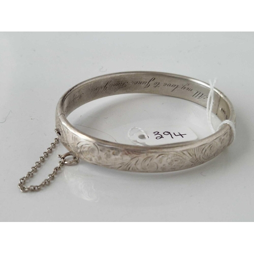 394 - A hinged silver bangle 18 gms