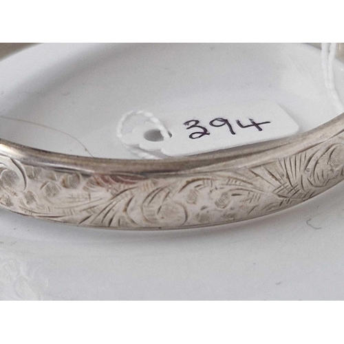 394 - A hinged silver bangle 18 gms