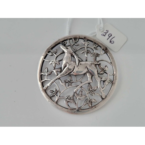 396 - A circular silver brooch with deer decoration 18 gms