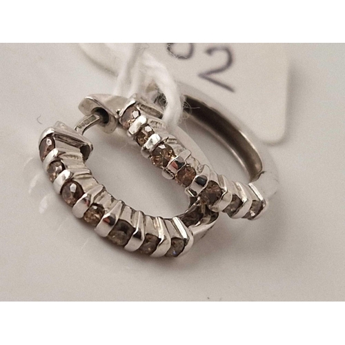 402 - A pair of white gold champagne diamond hoop earrings 9ct