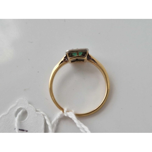 427 - A emerald and diamond ring 18ct gold size M 2.2 gms