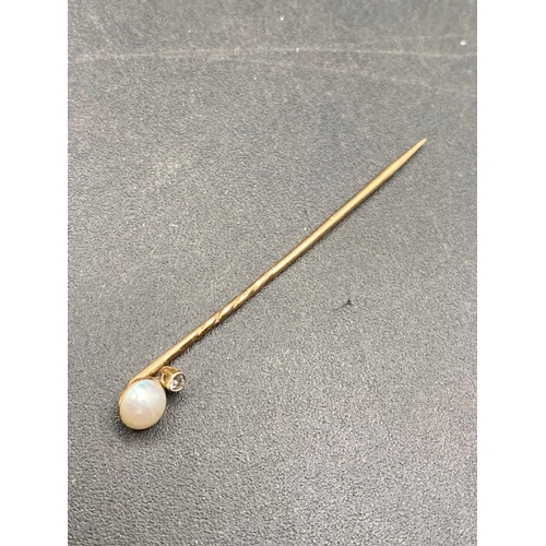 443 - A vintage real pearl and diamond stick pin