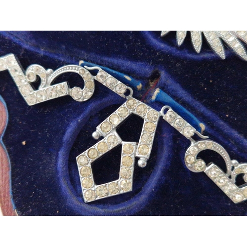 461 - A boxed set of jewellery including brooch earrings and clip