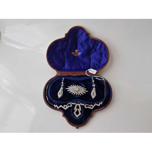 461 - A boxed set of jewellery including brooch earrings and clip