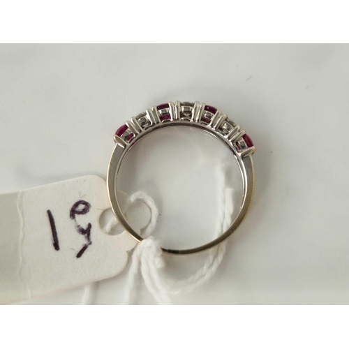 51 - A WHITE GOLD RUBY AND DIAMOND HALF ETERNITY RING 18CT GOLD APPROX 0.50 CARATS SIZE O 2.7 GMS BOXED