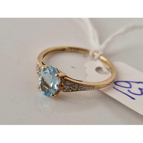 63 - A aquamarine and diamond ring 9ct size O