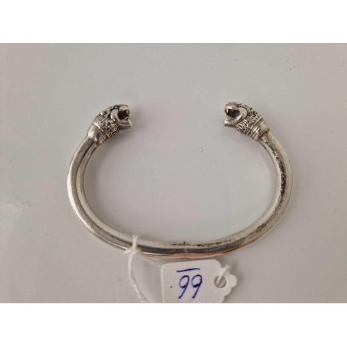 66 - A heavy silver lion head torque bangle AF 47 gms