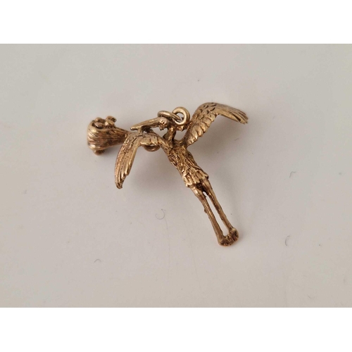 70 - A vintage stork and baby charm 9ct 2 gms