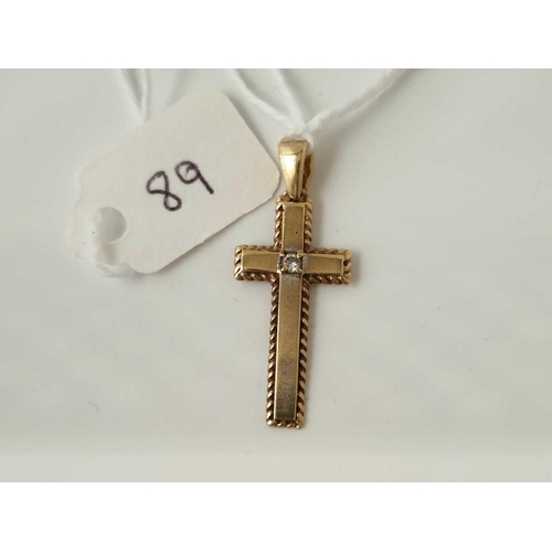 89 - A cross pendant with diamond 9ct 1.5 gms