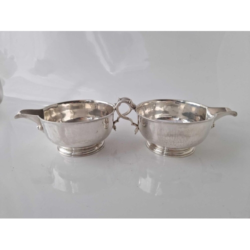 895 - Good pair of circular sauce boats, each on rim foot with hammered finish. 6.5 inch over handle . Lon... 