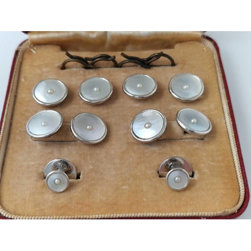 90 - A SET OF 9CT AND MOP DRESS STUDS