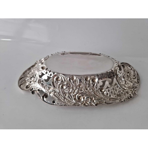 964 - Shaped oval bonbon dish , embossed and pierced with scrolls. 8 inch long . London  1902 By RP 79g