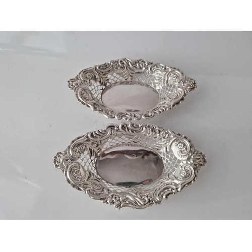 965 - Pair of boat shaped bonbon dishes also pierced and embossed. 6 inch long. Chester 1904 By H H.  75g