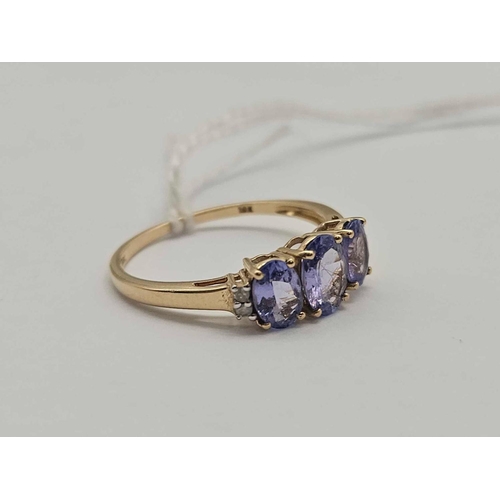 217 - A three stone tanzanite ring with diamond shoulders 10ct gold size S 1.9 gms