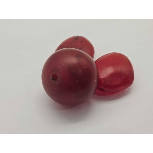 362 - Three large cherry amber beads 30.5 carats