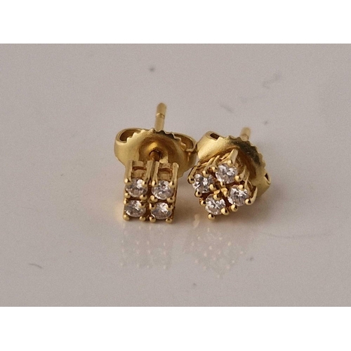 103 - A pair of four diamond square set earrings 18ct gold 1.4 gms