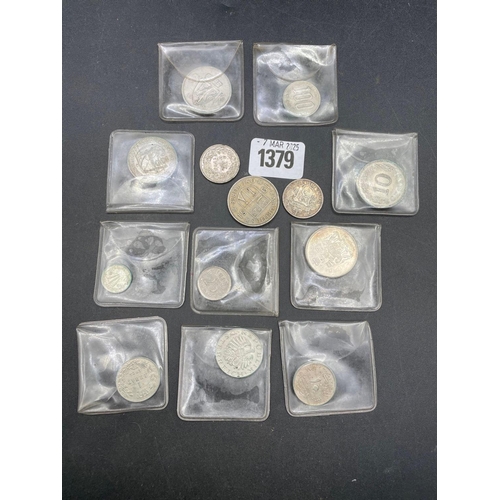 1379 - A bag of foreign silver coloured coins