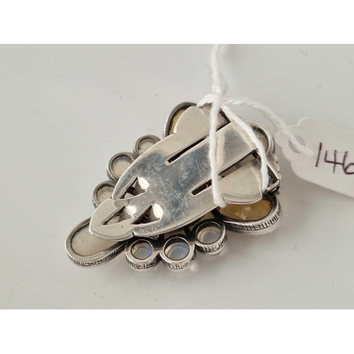 146 - A ANTIQUE ARTS AND CRAFTS SILVER DRESS CLIP BY DORRIE NOSSITER SET WITH MOONSTONES AND CITRINES