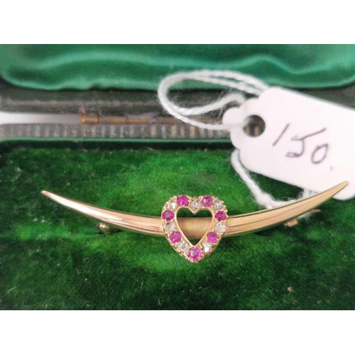 150 - A Edwardian gold crescent brooch with a central ruby and diamond set heart boxed