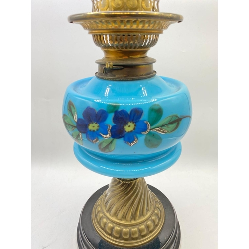 1585 - A Victorian glass and brass mounted oil lamp