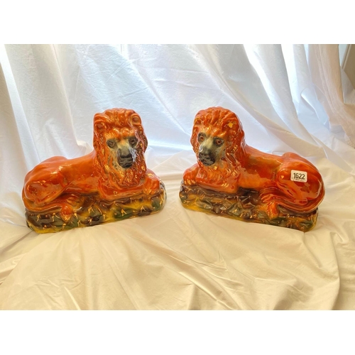 1622 - A pair of Staffordshire lions 13 inches long