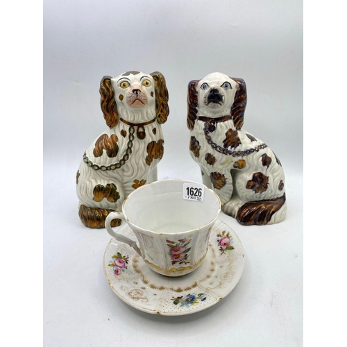 1626 - A pair of seated Staffordshire dogs 9 inches high and a cup and saucer