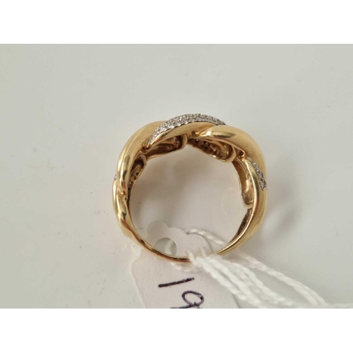 198 - A KNOT STYLE RING WITH DIAMONDS 18CT GOLD SIZE U 8.7 GMS