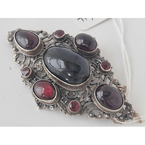 254 - A large 19th century Austro Hungarian silver, cabochon and faceted garnet brooch