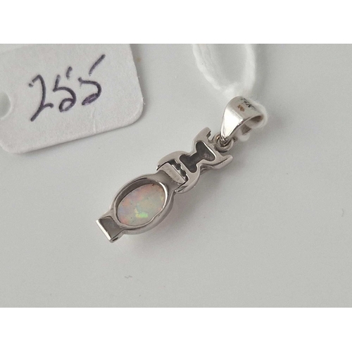 255 - A white gold and opal pendant 14ct gold 1.7 gms