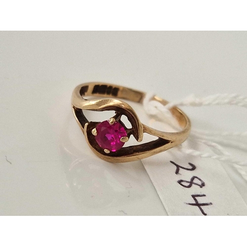 284 - A red stone ring 9ct size O 2.3 gms