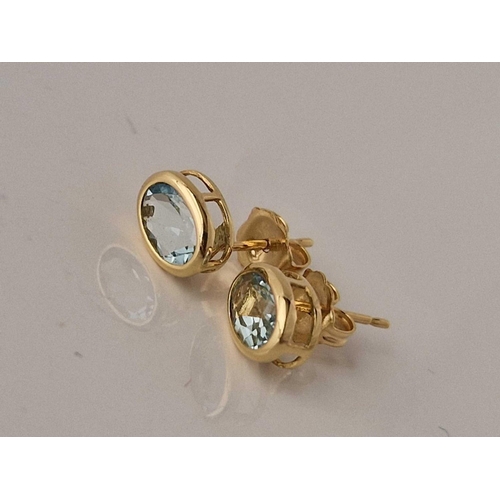 302 - A pair of aquamarine set earrings 18ct gold 7.5 X 6mm