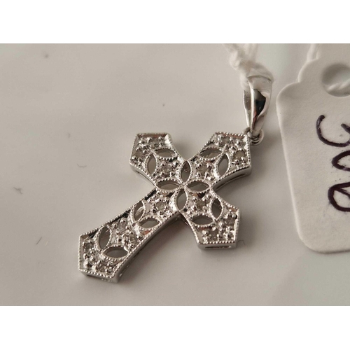 306 - A white gold diamond cross pendant 9ct