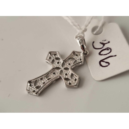 306 - A white gold diamond cross pendant 9ct