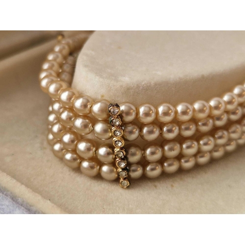 333 - A boxed four row choker with stone set clasp 12 inch