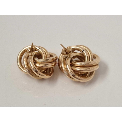 35 - A large pair of knot ear studs 9ct 6.1 gms