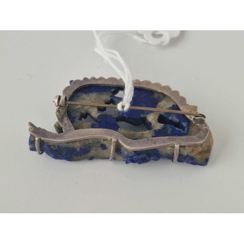 353 - A silver and carved lapis floral brooch