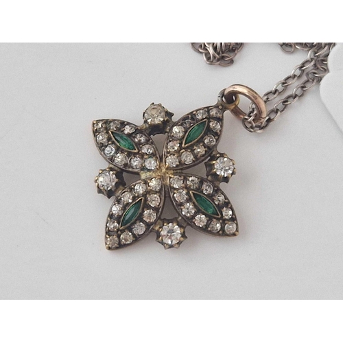 355 - A Victorian Gold pendant set with green and white paste stone on silver chain 17 inch