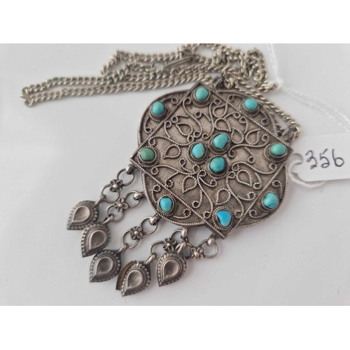 356 - A ethnic silver and turquoise pendant necklace