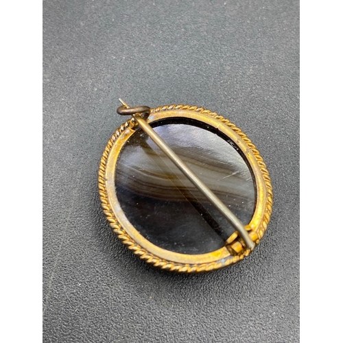 363 - A Victorian banded onyx brooch with gold rope twist frame