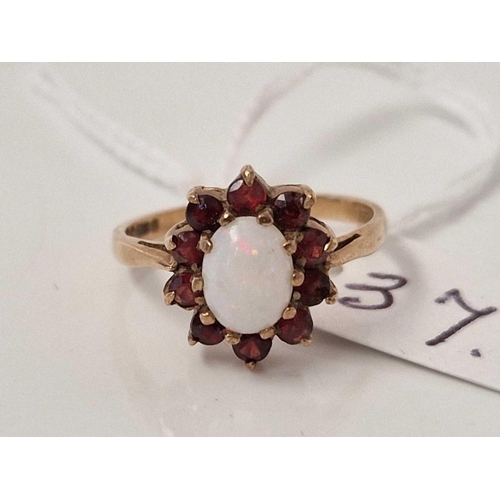 37 - A opal and garnet ring 9ct size L 2.2 gms