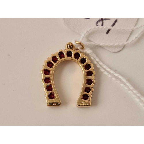 381 - A ruby horse shoe gEm set pendant 14ct gold 2.4 gms