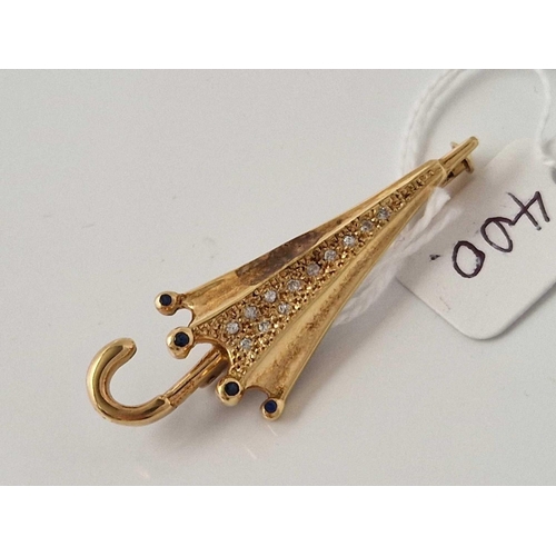 400 - A DIAMOND SET UMBRELLA SHAPED BROOCH 18CT GOLD 5.4 GMS